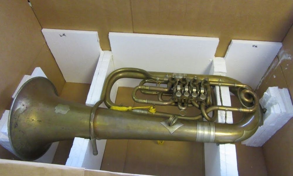 Securing the fragile instrument prevents it from moving inside the box