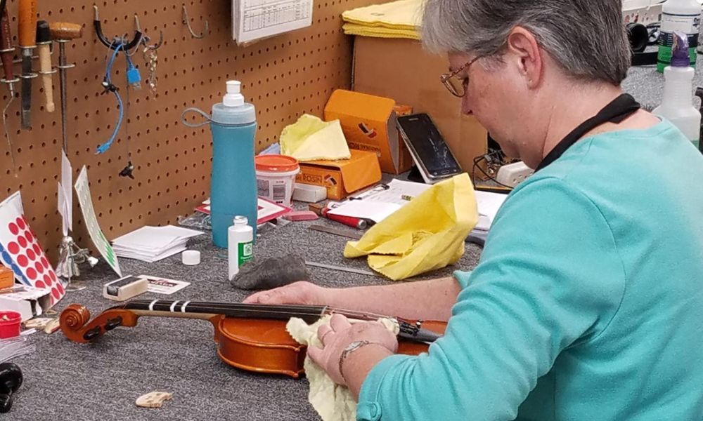 The woman is cleaning and preparing to get her equipment ready for sale